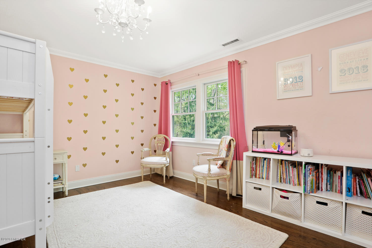 277 Cognewaugh Road Cos Cob, CT 06807 - Photo 19 of 34 a bedroom with furniture and a book shelf