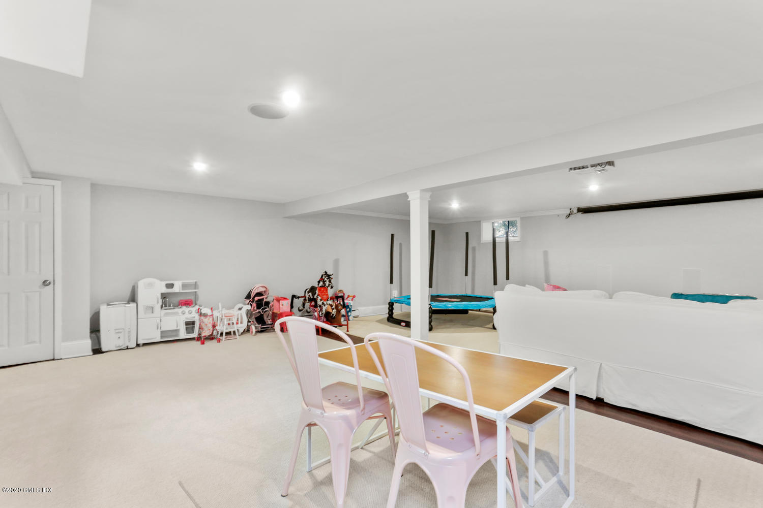 277 Cognewaugh Road Cos Cob, CT 06807 - Photo 24 of 34 a very nice looking room with a large window and furniture