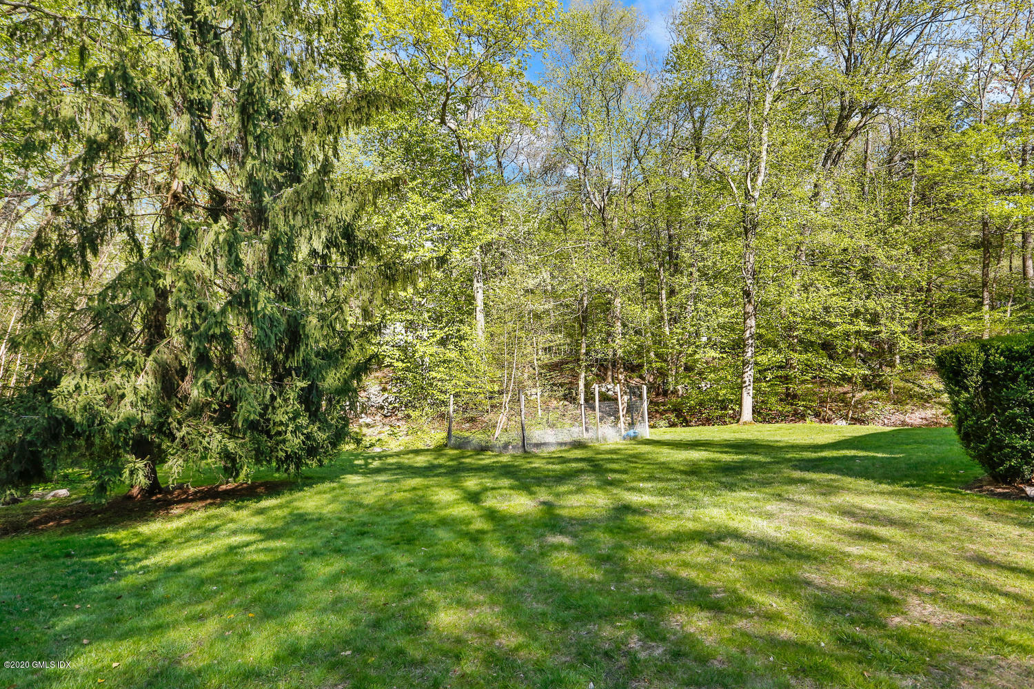 277 Cognewaugh Road Cos Cob, CT 06807 - Photo 26 of 34 a big yard with lots of green space and trees