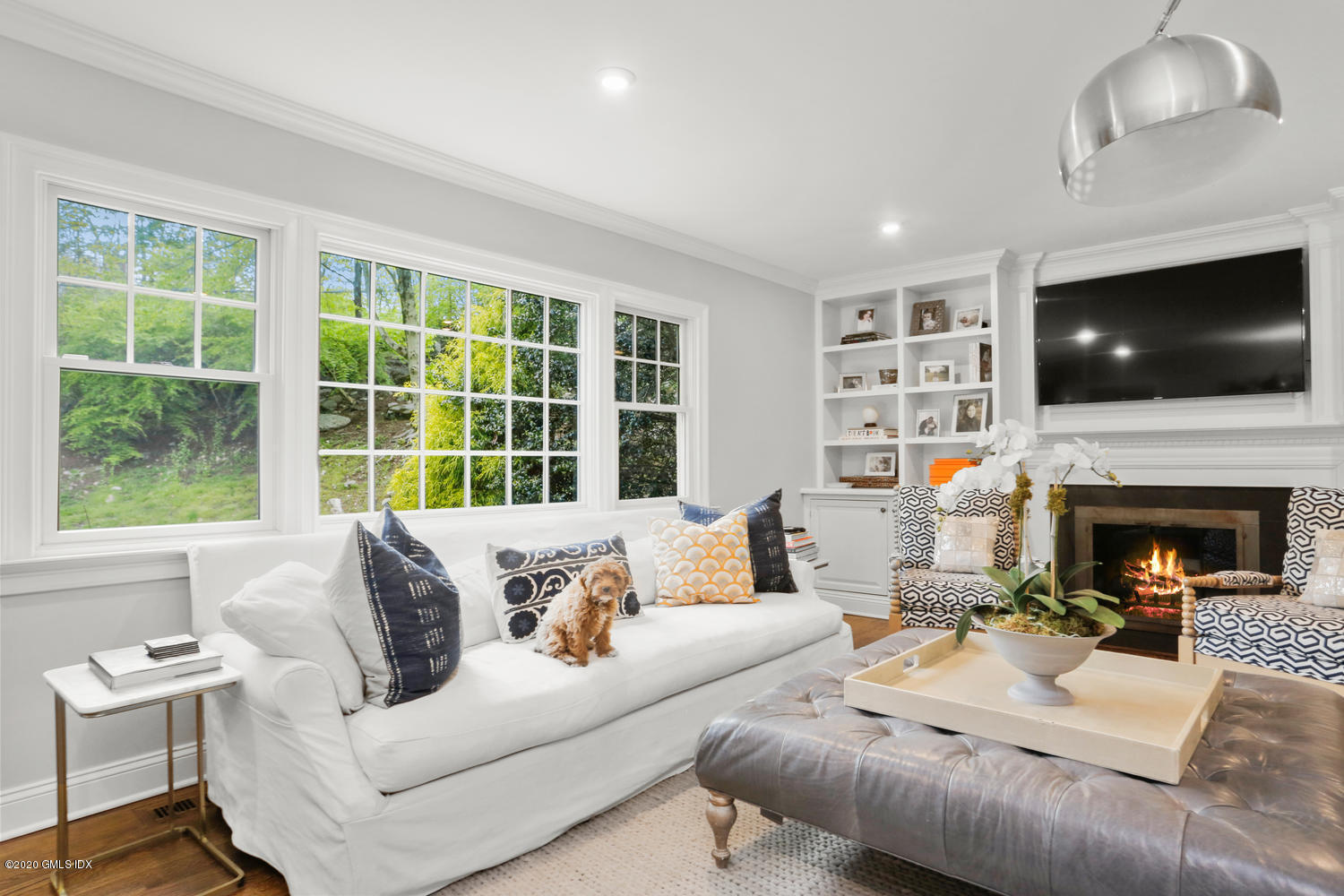 277 Cognewaugh Road Cos Cob, CT 06807 - Photo 5 of 34 a living room with fireplace furniture and a flat screen tv