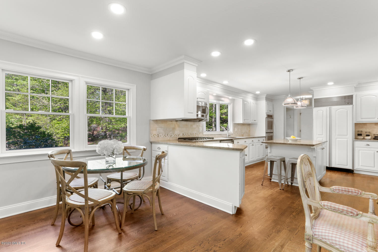 277 Cognewaugh Road Cos Cob, CT 06807 - Photo 8 of 34 a kitchen with a table and chairs in it