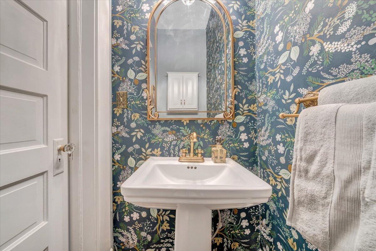 1307 Maple Avenue Southwest Roanoke, VA 24016 - Photo 31 of 53 a bathroom with a sink and a mirror
