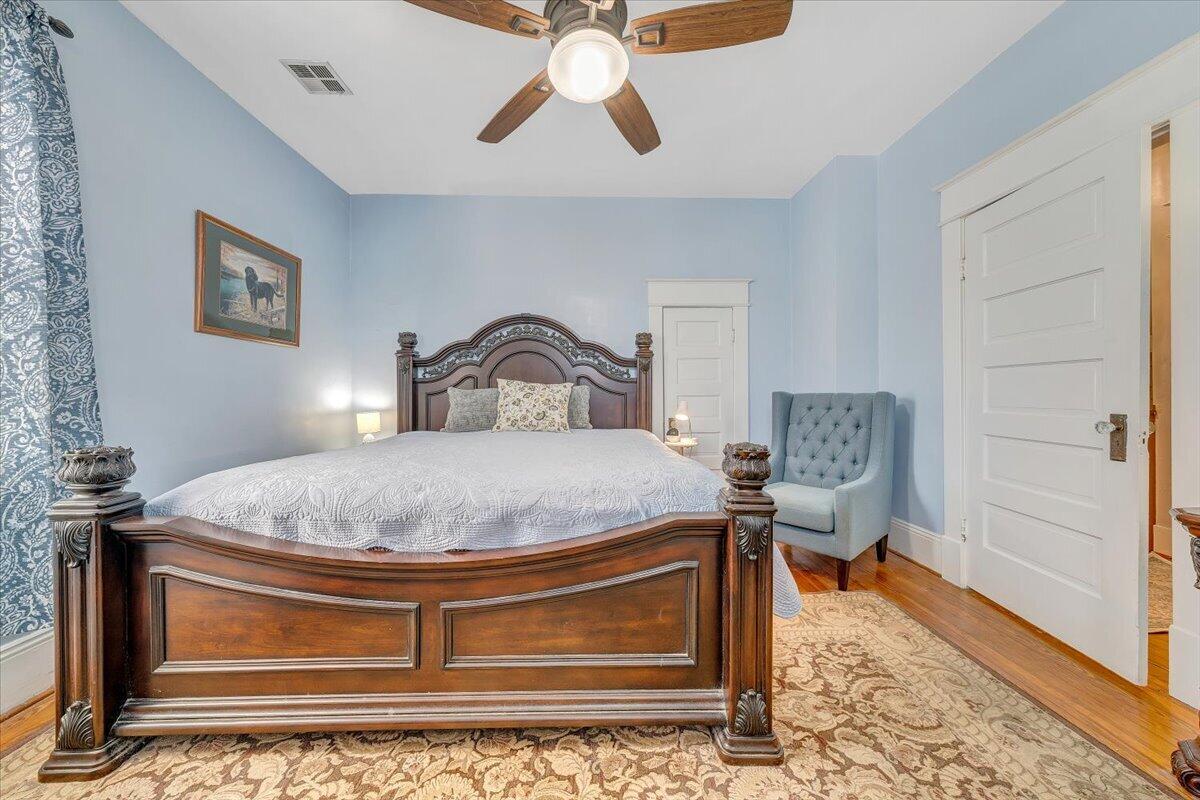 1307 Maple Avenue Southwest Roanoke, VA 24016 - Photo 33 of 53 a bedroom with a bed and wooden floor
