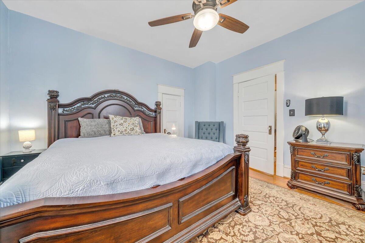 1307 Maple Avenue Southwest Roanoke, VA 24016 - Photo 34 of 53 a bedroom with a bed and a chandelier