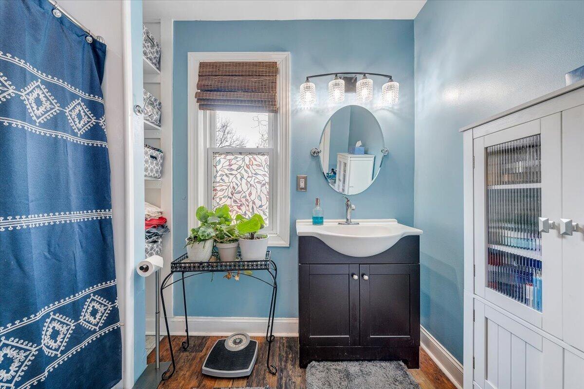 1307 Maple Avenue Southwest Roanoke, VA 24016 - Photo 41 of 53 a bathroom with a sink and a mirror
