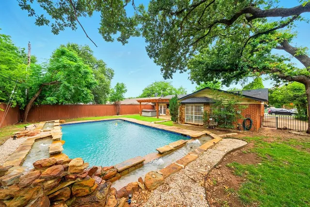 a view of swimming pool with lounge chair