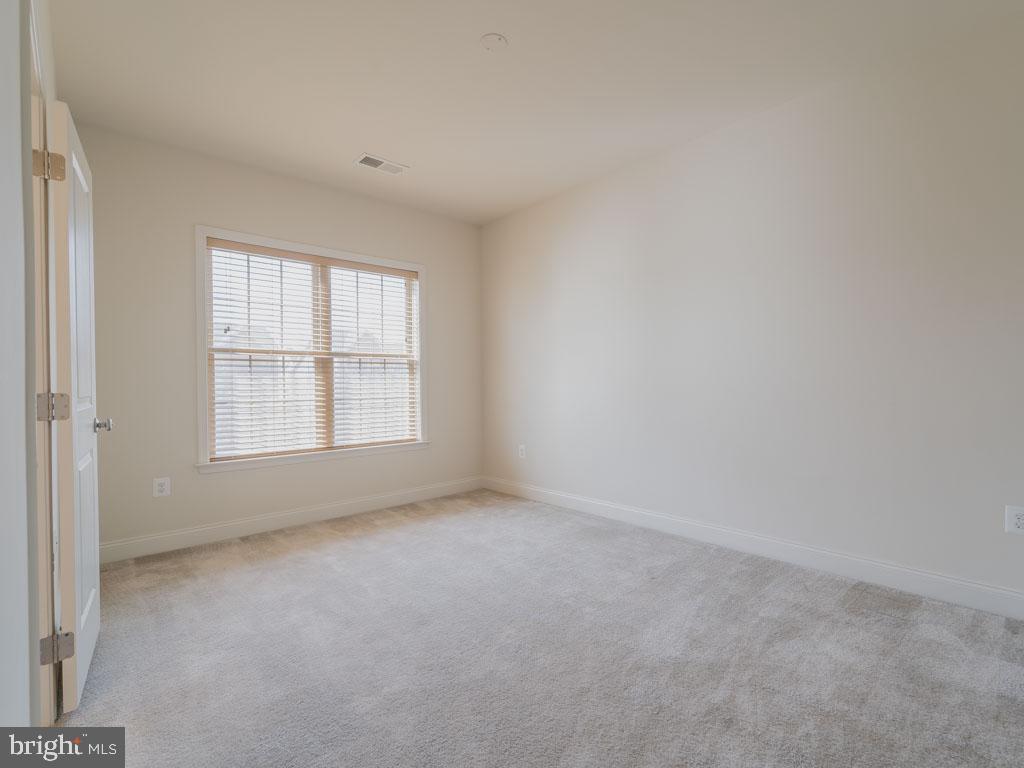 22595 Windsor Locks Square Ashburn, VA 20148 - Photo 50 of 56 an empty room with a window