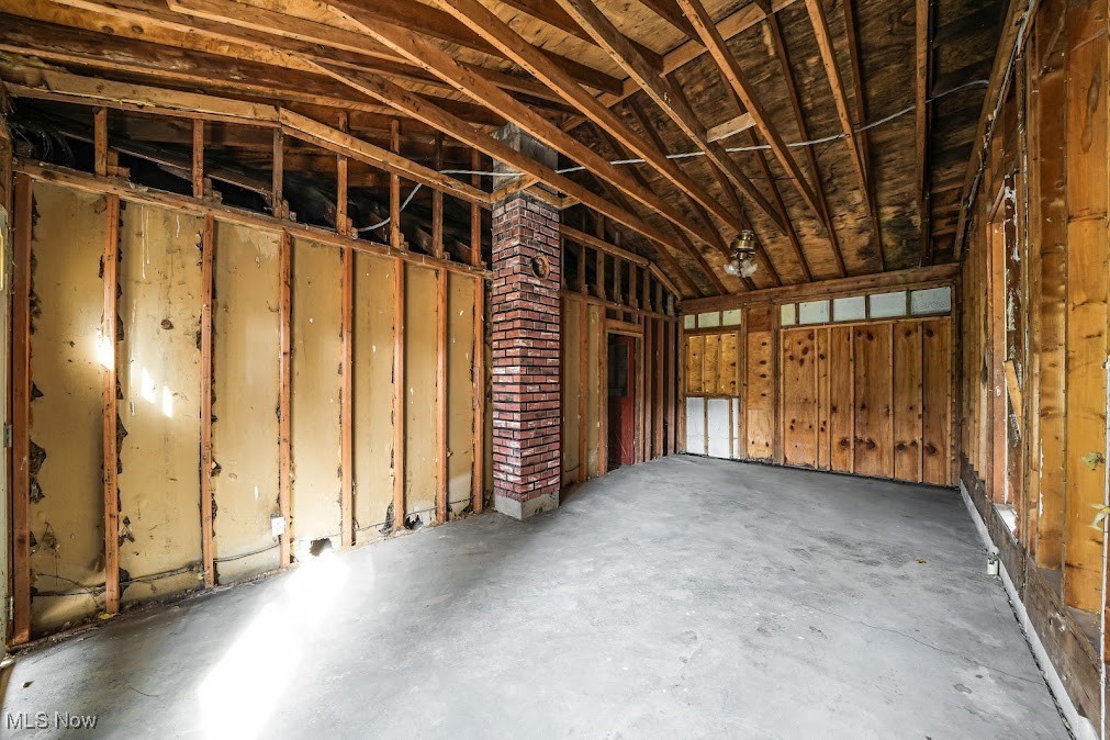 5552 Nelson Mosier Road Southington, OH 44470 - Photo 9 of 24 Breezeway featuring vaulted ceiling and concrete floors