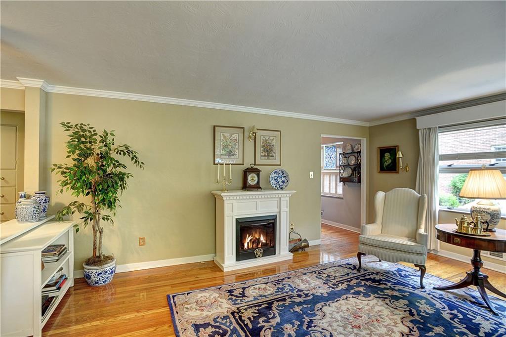 205 Quaker Road Sewickley, PA 15143 - Photo 4 of 18 Well conditioned hardwood floors and crown molding round out the living room