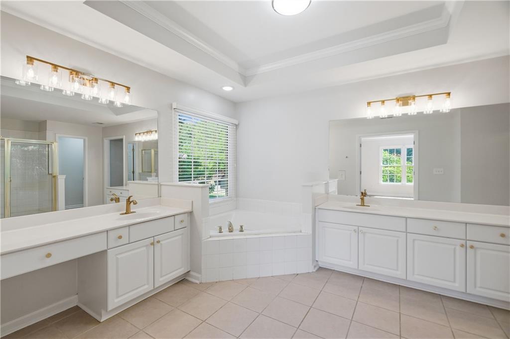 110 Mayes Farm Road Northwest Marietta, GA 30064 - Photo 24 of 49 a bathroom with a sink mirror and a bathtub