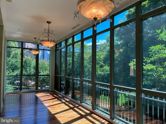 a view of a balcony with wooden floor