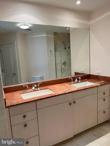 a bathroom with bathtub and window