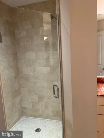 a kitchen with granite countertop a sink and cabinets