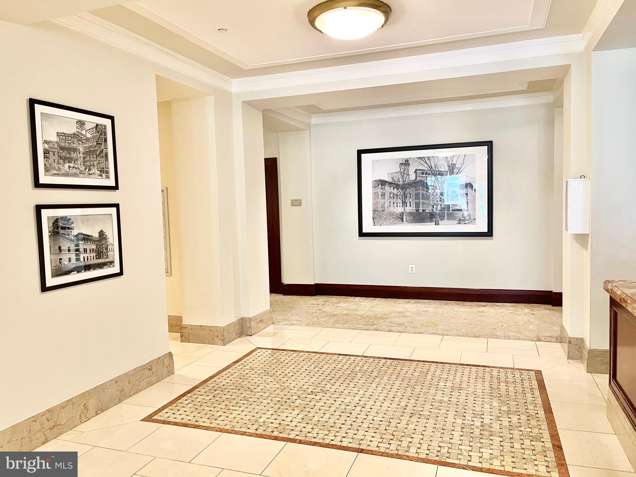2425 L Street Northwest, Unit 215 Washington, DC 20037 - Photo 31 of 38 a bedroom with a bed and the view of painting on the wall