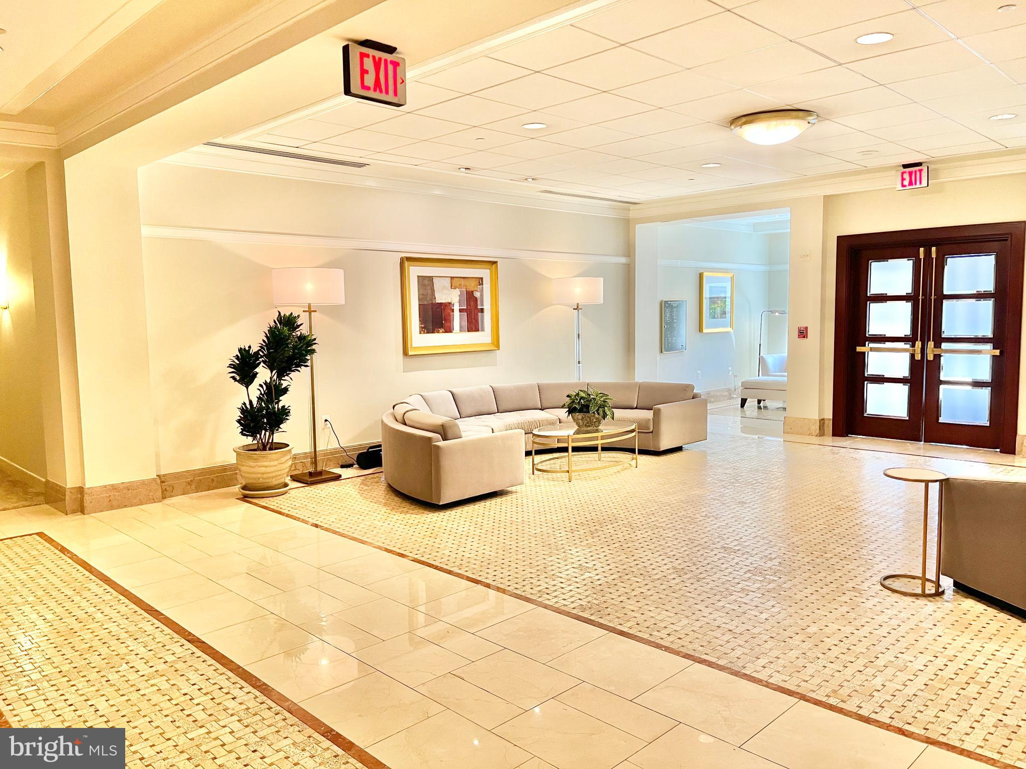 2425 L Street Northwest, Unit 215 Washington, DC 20037 - Photo 32 of 38 a bedroom with furniture and window
