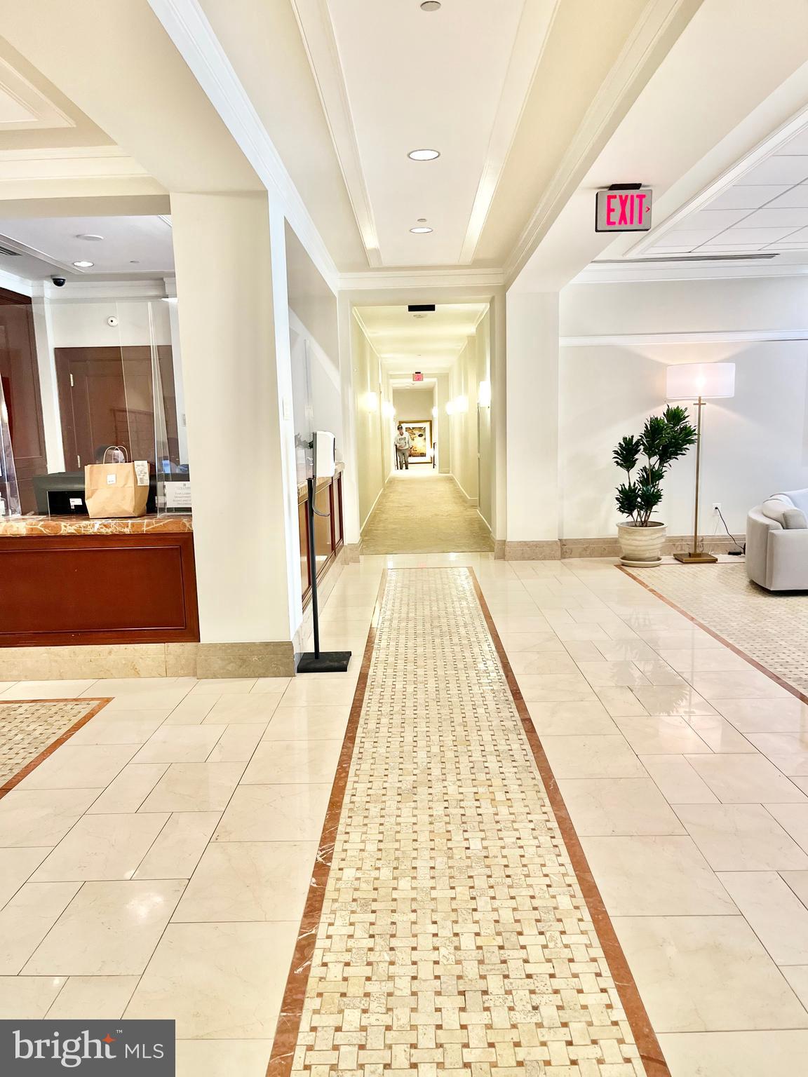 2425 L Street Northwest, Unit 215 Washington, DC 20037 - Photo 34 of 38 a view of a bedroom with wooden floor