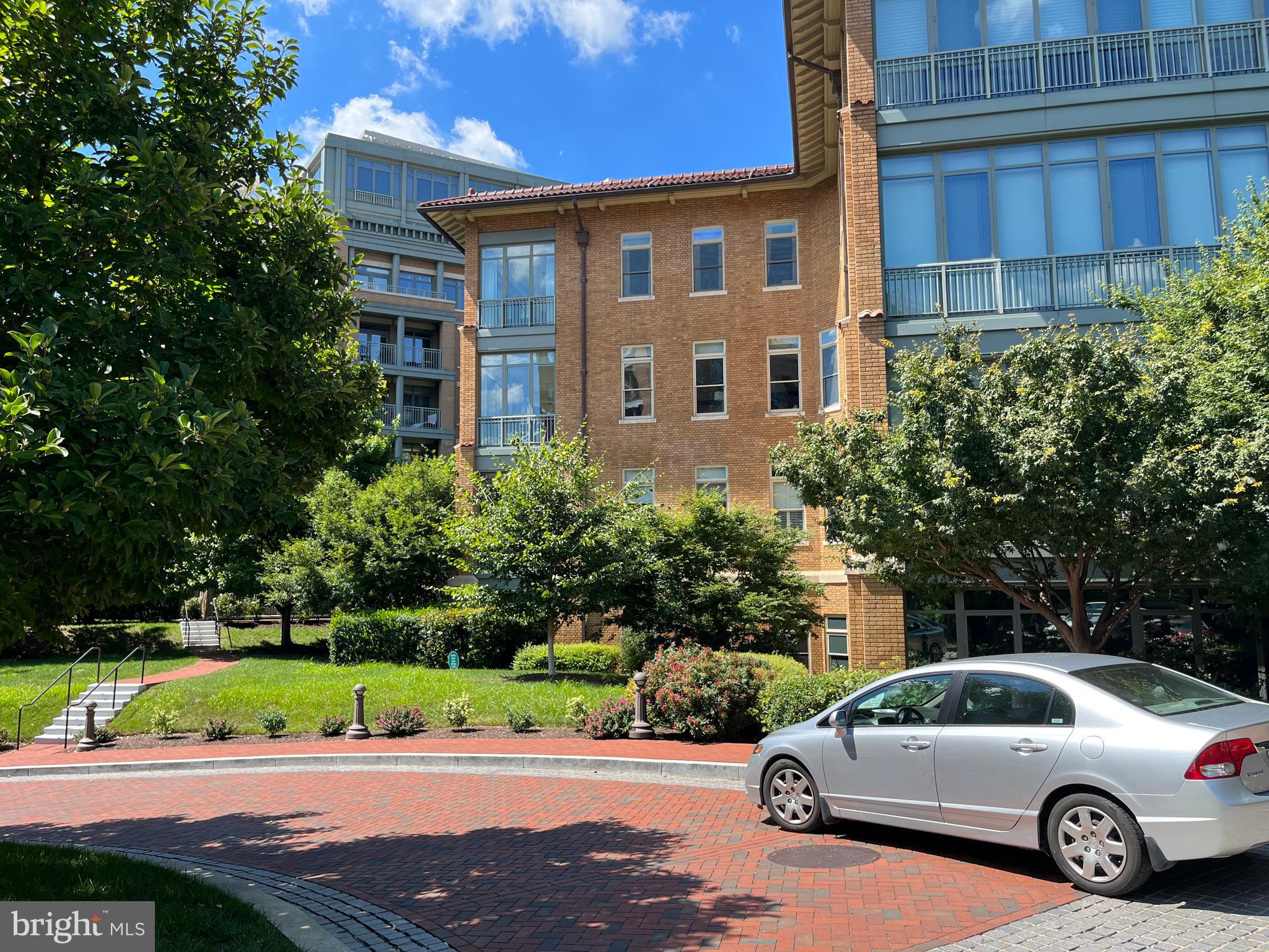 2425 L Street Northwest, Unit 215 Washington, DC 20037 - Photo 36 of 38 a view of a car parked in front of a building