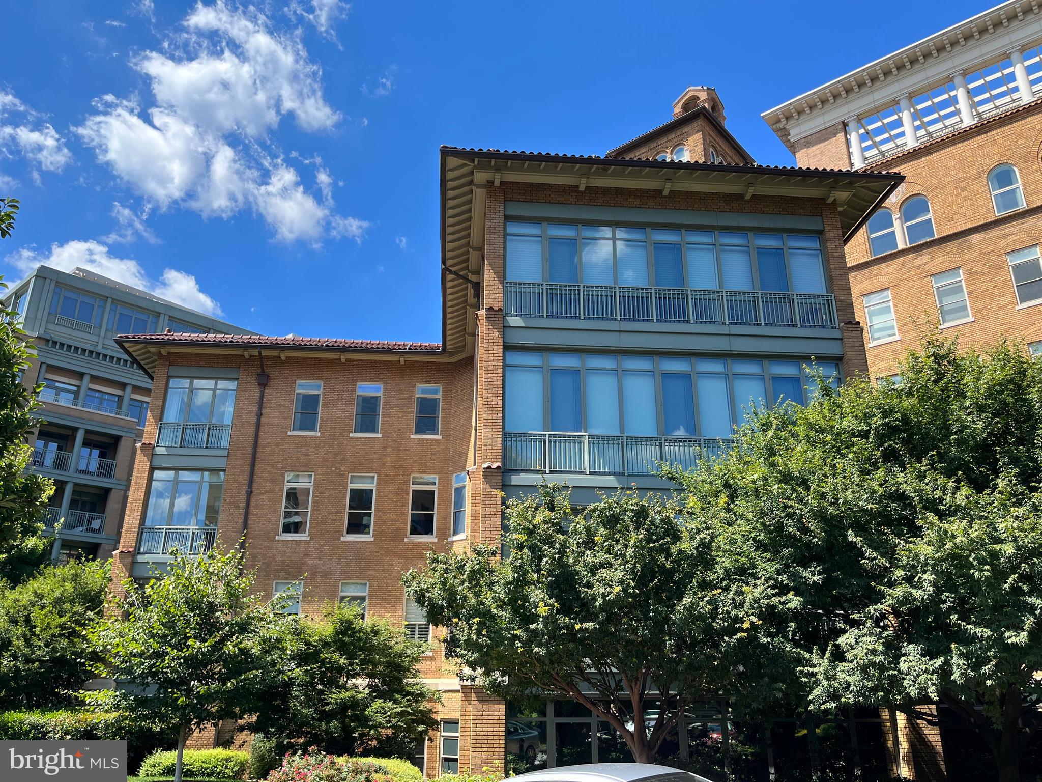 2425 L Street Northwest, Unit 215 Washington, DC 20037 - Photo 4 of 38 a front view of a house with a yard