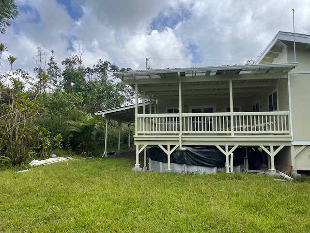 14-3417 Molokai Road Pahoa, HI 96778 - Photo 2 of 11 a view of a chair and table on the wooden deck