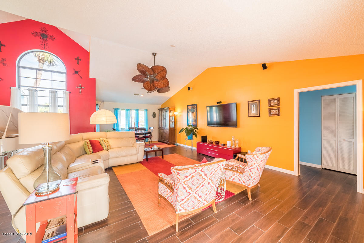 1508 Meadowbrook Road Northeast Palm Bay, FL 32905 - Photo 14 of 42 a living room with furniture and a large window