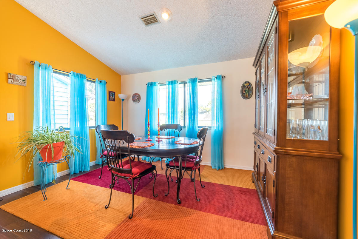 1508 Meadowbrook Road Northeast Palm Bay, FL 32905 - Photo 15 of 42 a view of a dining room with furniture window and outside view