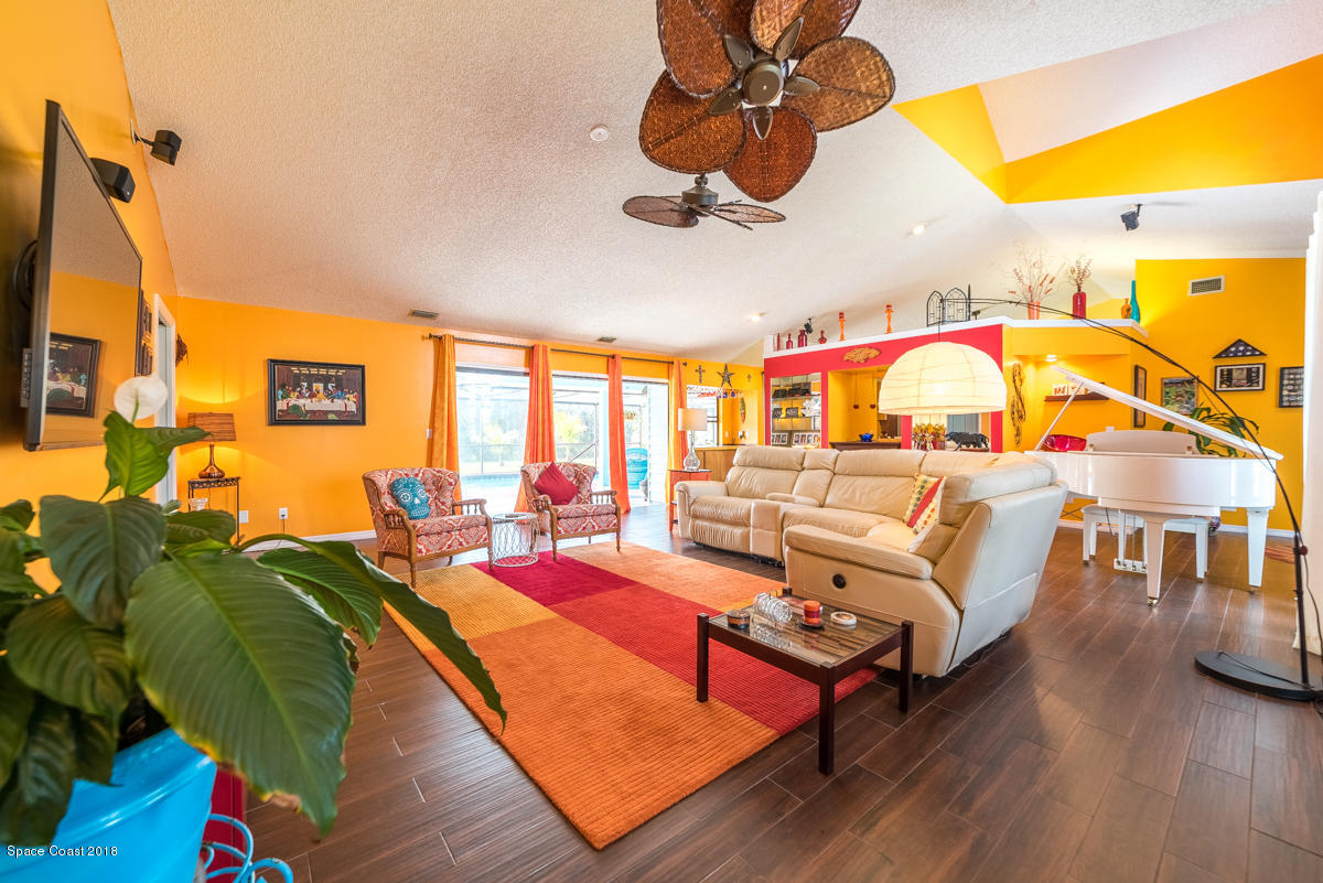 1508 Meadowbrook Road Northeast Palm Bay, FL 32905 - Photo 16 of 42 a living room with furniture pool table and a large window