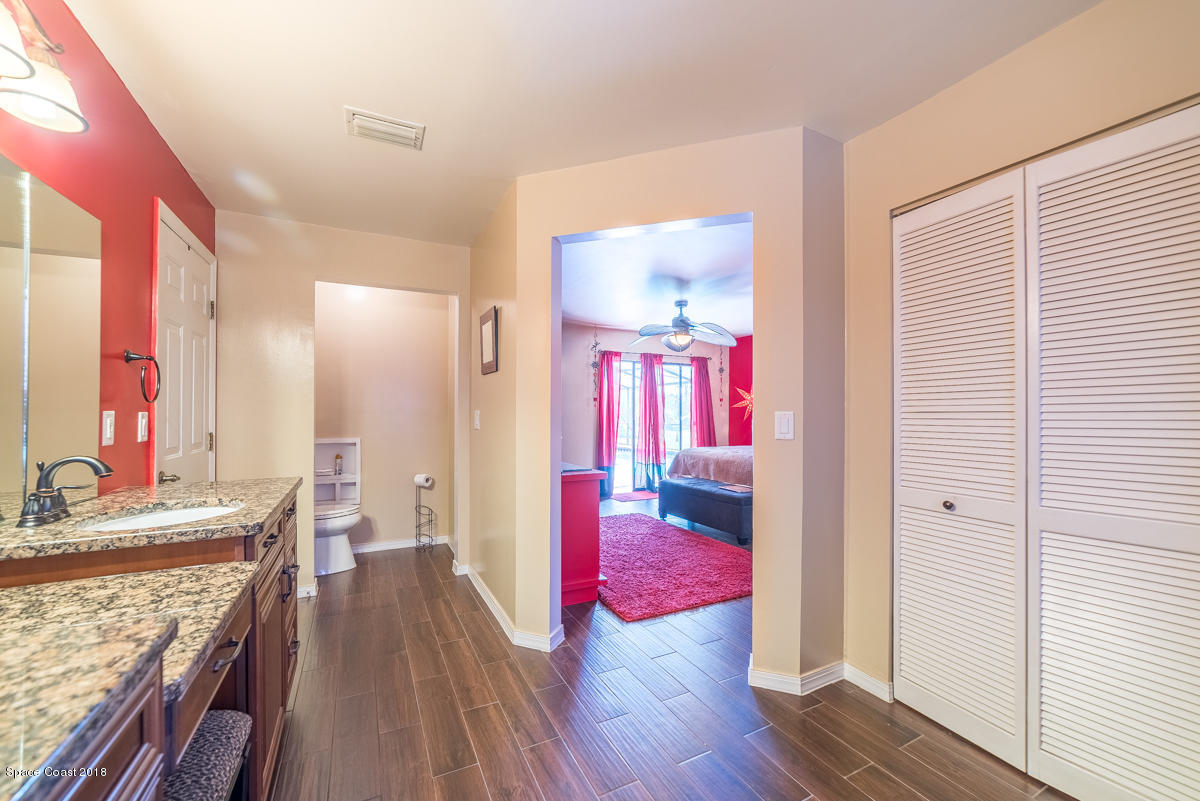 1508 Meadowbrook Road Northeast Palm Bay, FL 32905 - Photo 35 of 42 a very nice looking room with wooden floor