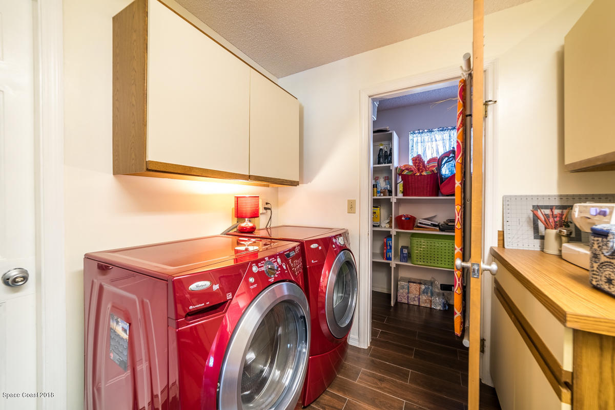 1508 Meadowbrook Road Northeast Palm Bay, FL 32905 - Photo 36 of 42 a utility room with dryer and washer