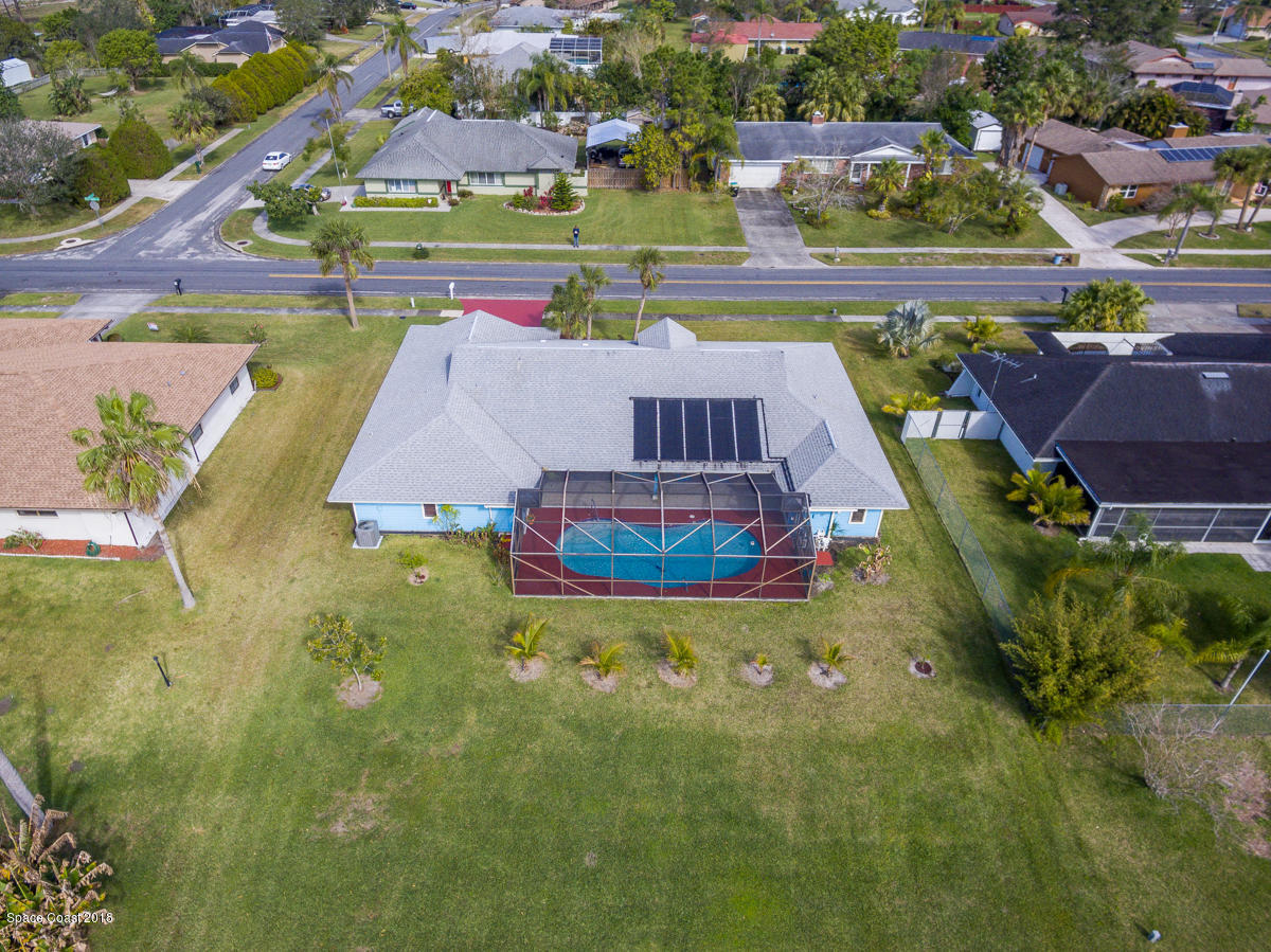 1508 Meadowbrook Road Northeast Palm Bay, FL 32905 - Photo 40 of 42 an aerial view of a house with a swimming pool