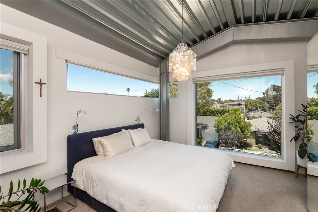 1149 Pine Avenue Manhattan Beach, CA 90266 - Photo 29 of 43 a bed sitting in a bedroom next to a window