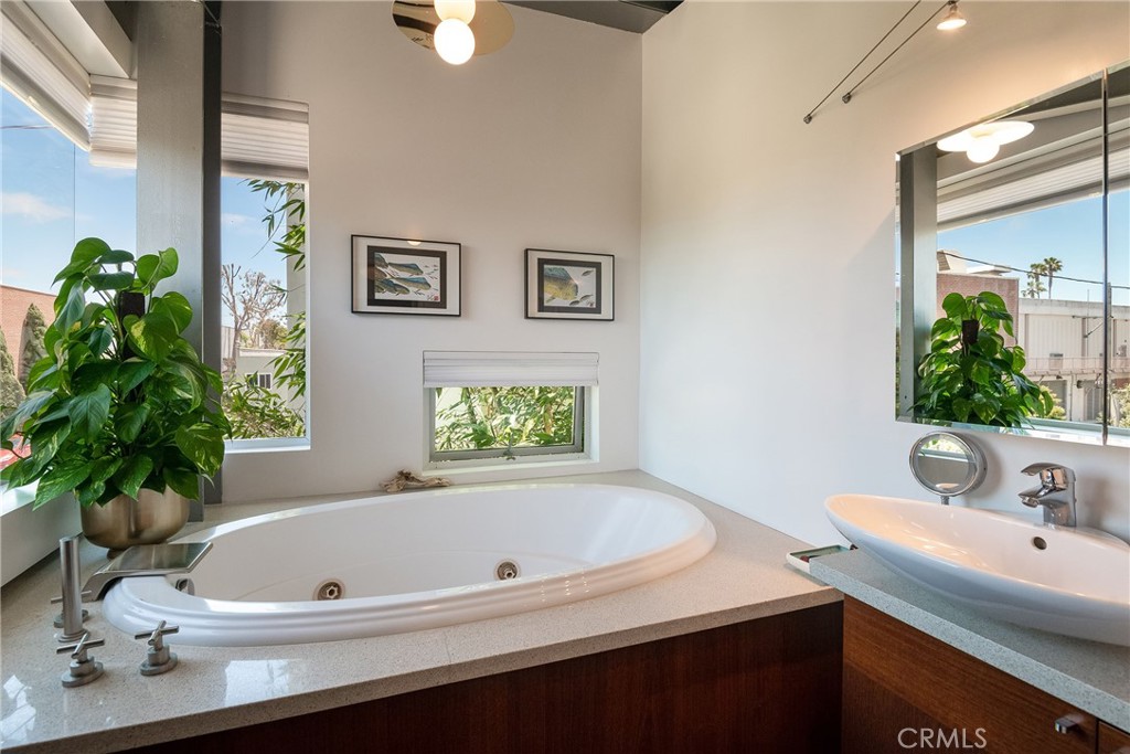 1149 Pine Avenue Manhattan Beach, CA 90266 - Photo 34 of 43 a bathroom with a bathtub a sink and a window