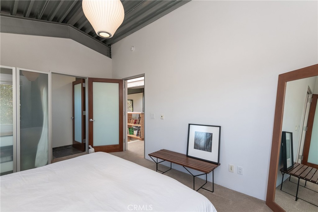 1149 Pine Avenue Manhattan Beach, CA 90266 - Photo 38 of 43 a bedroom with a bed and a flat screen tv