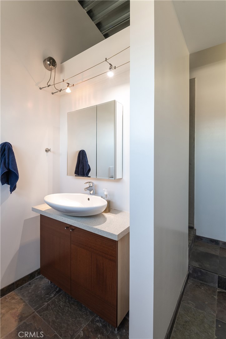 1149 Pine Avenue Manhattan Beach, CA 90266 - Photo 40 of 43 a bathroom with a sink and a mirror