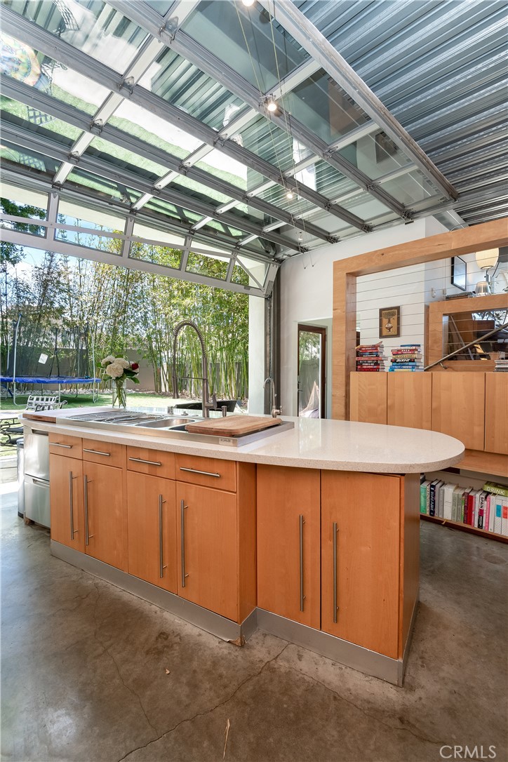 1149 Pine Avenue Manhattan Beach, CA 90266 - Photo 10 of 43 a dining hall with stainless steel appliances granite countertop a sink and wooden floors