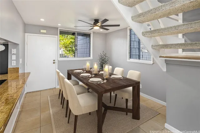 a view of a dining room with furniture and a window
