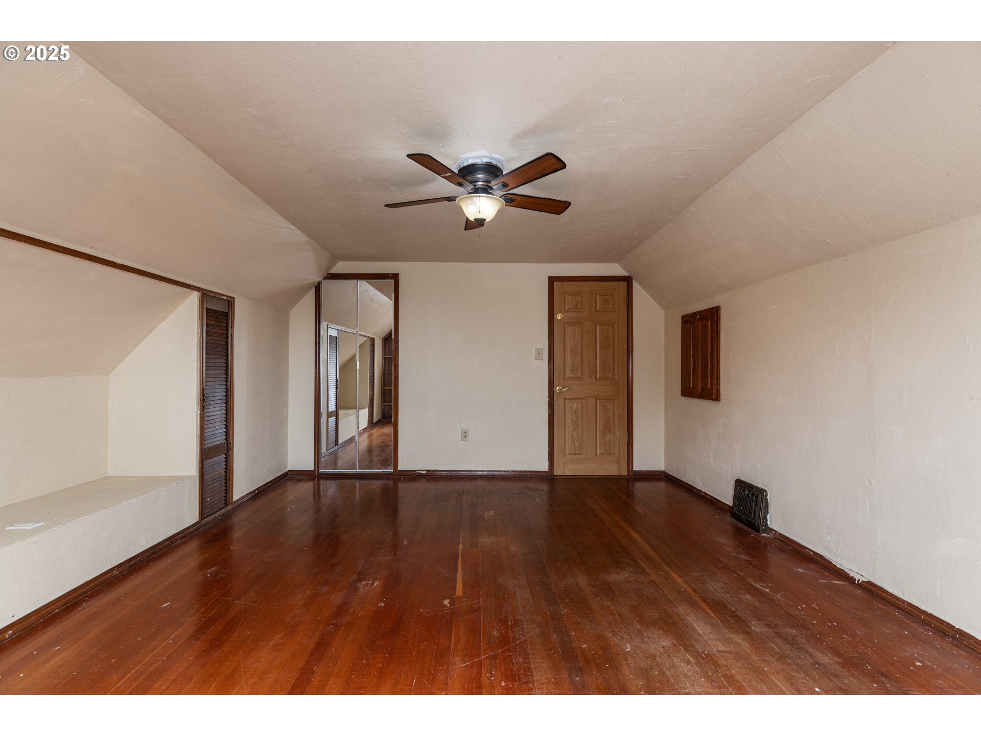 169 MacArthur Street St. Helens, OR 97051 - Photo 11 of 31 a view of an empty room with window and wooden floor