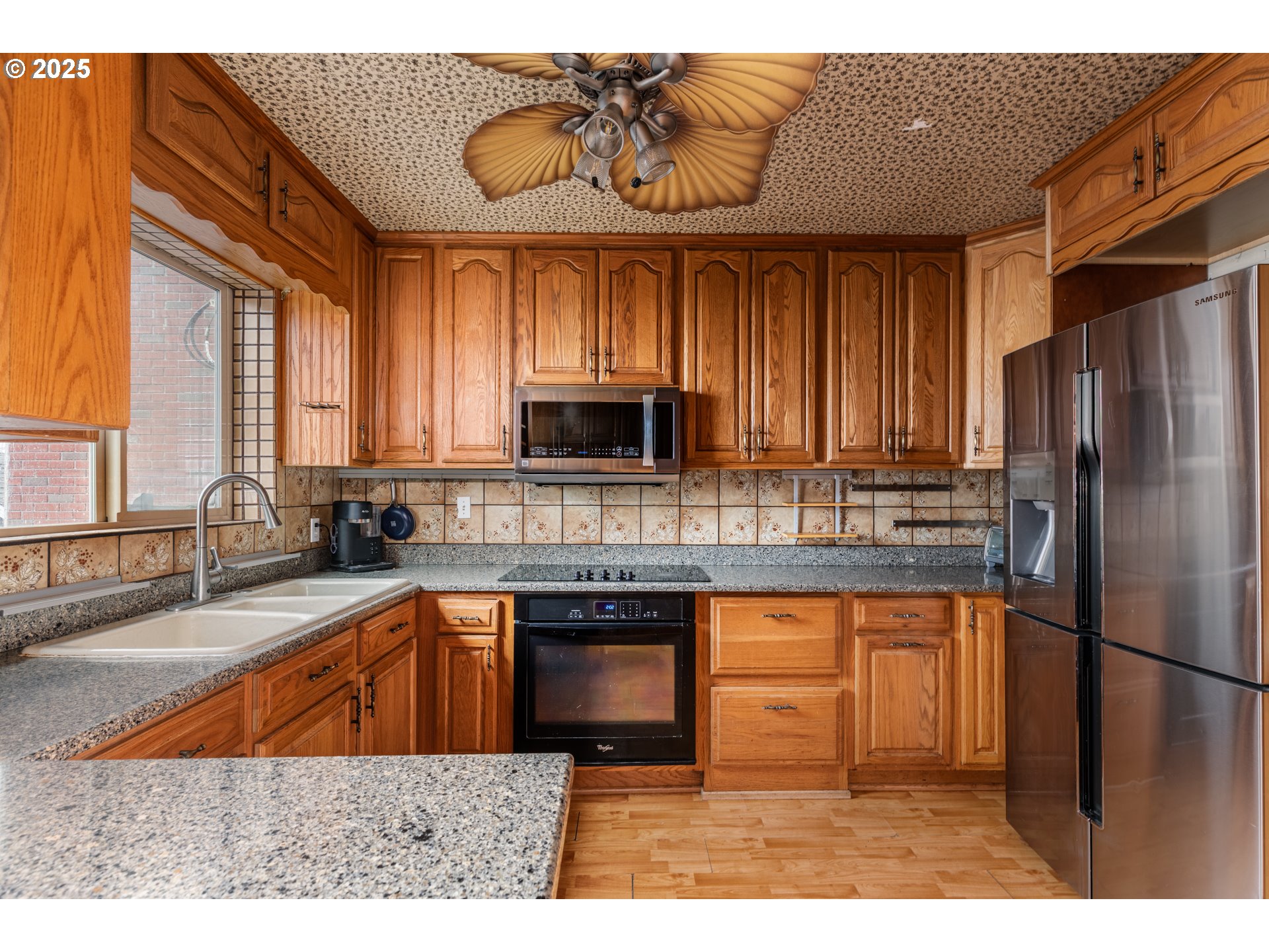 169 MacArthur Street St. Helens, OR 97051 - Photo 4 of 31 a kitchen with stainless steel appliances granite countertop a sink a stove and refrigerator