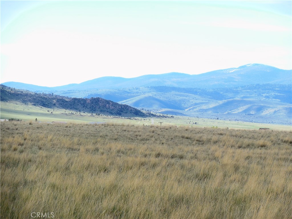 123 Tbd Raghorn Court Ennis, MT 59729 - Photo 8 of 18 a view of a large mountain with mountains in the background