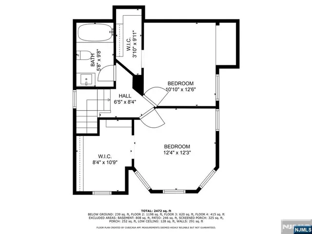 a picture of a bench in front of a wall