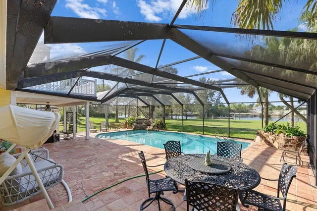 a view of a house with sitting area and a small yard