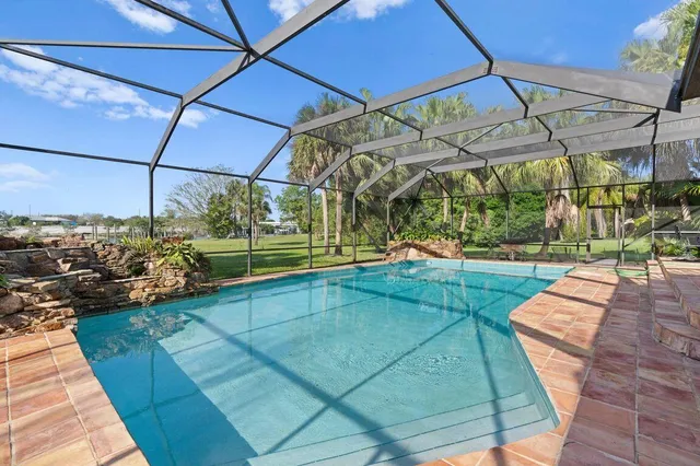 a view of swimming pool with a yard
