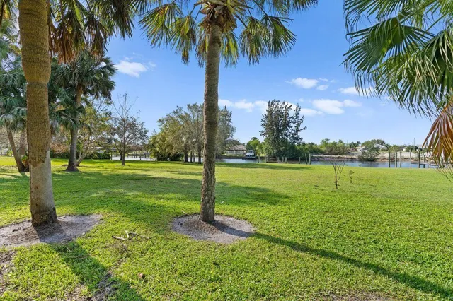 a living room with furniture and a wall painting