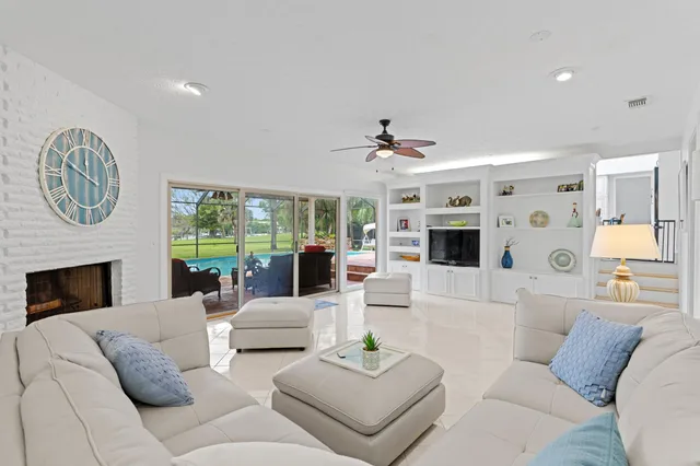 a bathroom with a granite countertop sink toilet a mirror and shower