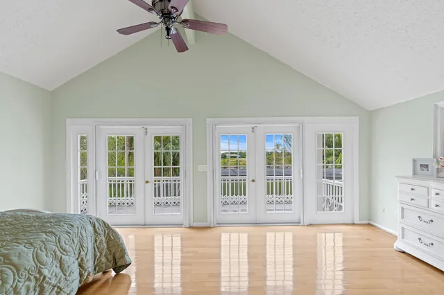 a bathroom with a granite countertop sink a toilet and a shower