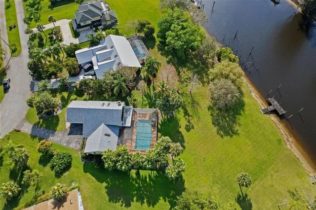 an aerial view of multiple houses with yard