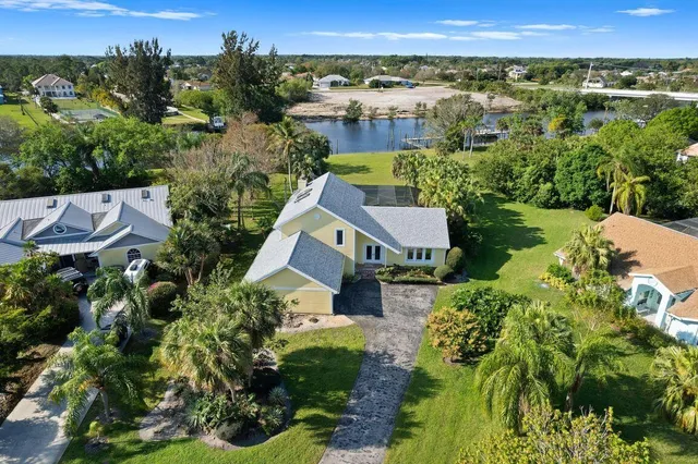 an aerial view of city lake and residential houses with outdoor space and river