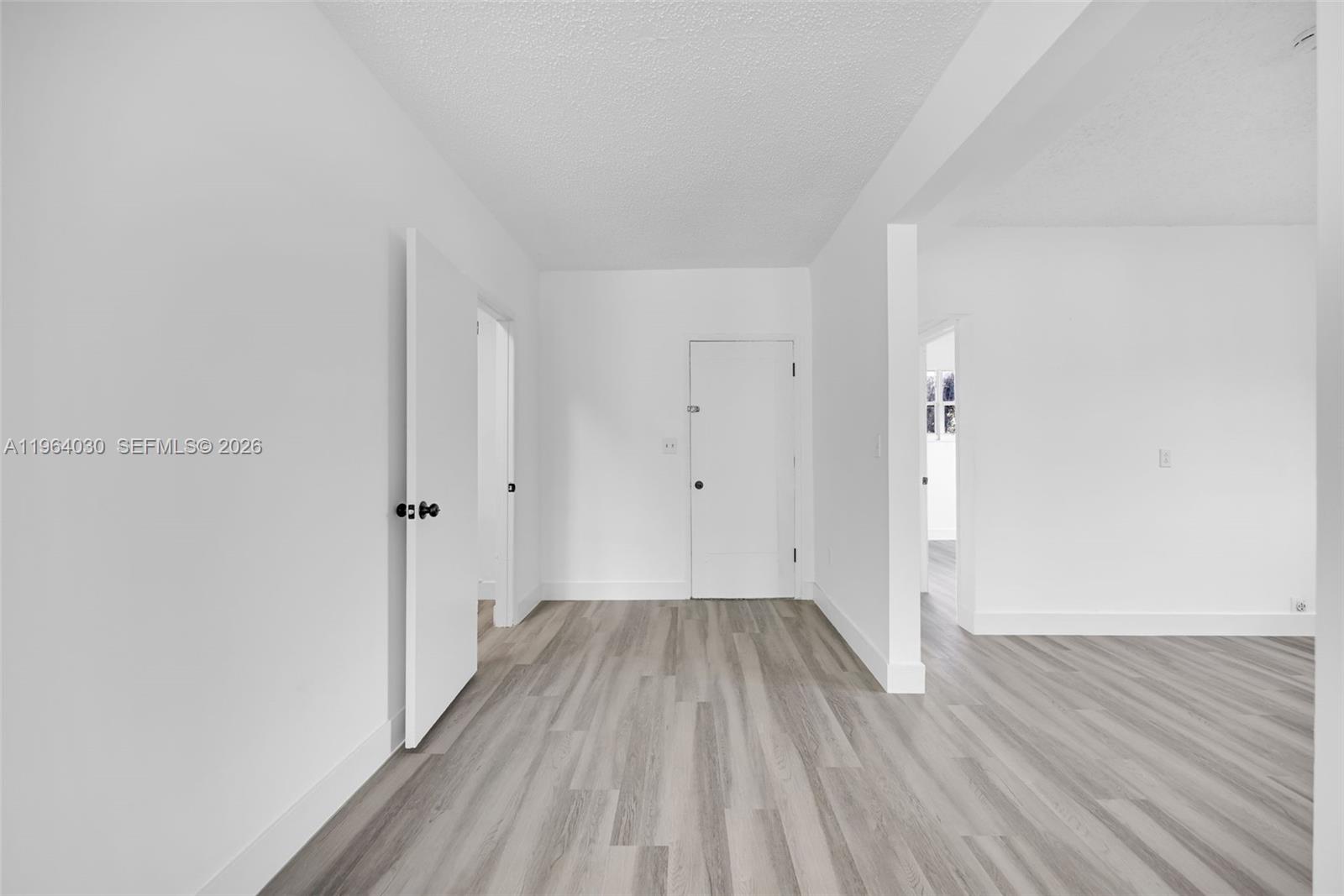 1391 Northwest 102nd Street, Unit 1391 Miami, FL 33147 - Photo 30 of 32 a view of a room with wooden floor