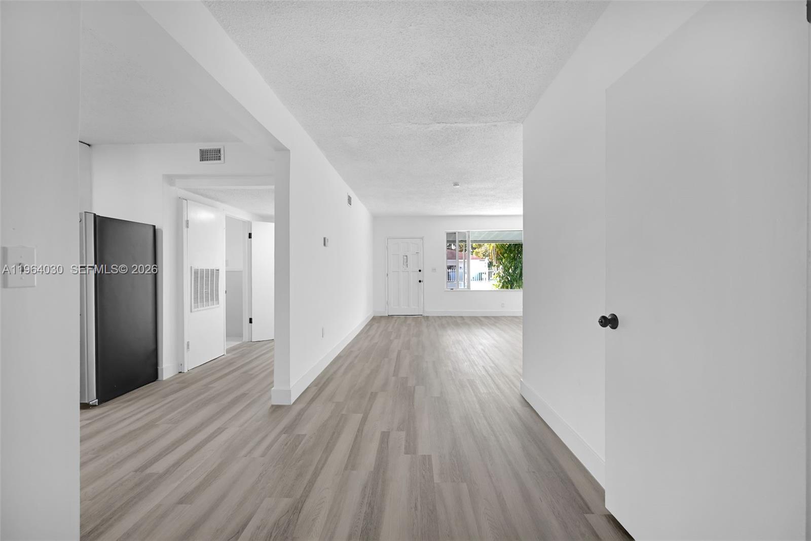 1391 Northwest 102nd Street, Unit 1391 Miami, FL 33147 - Photo 31 of 32 a view of hallway with wooden floor