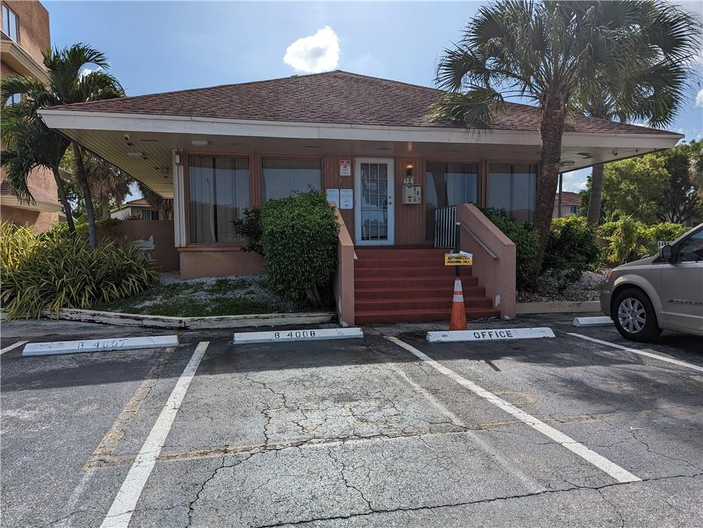 17530 Northwest 68th Avenue, Unit C4006 Hialeah, FL 33015 - Photo 4 of 5 a view of a car park in front of house