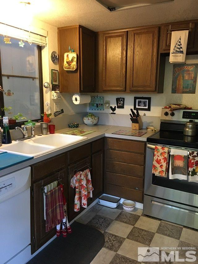 1611 Foster Drive Reno, NV 89509 - Photo 17 of 35 a kitchen with a sink cabinets and appliances